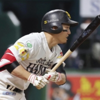 SoftBank's Ryoya Kurihara drives in two runs in the sixth inning against the Marines in Fukuoka on Saturday. | KYODO