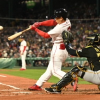 Red Sox left fielder Masataka Yoshida hits a two-run home run against the Pirates during the first inning at Boston's Fenway Park on Monday. | USA TODAY / VIA REUTERS