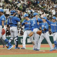 The Fighters celebrates after their win over the Lions on Thursday. | KYODO