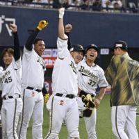 Buffaloes slugger Yutaro Sugimoto (center) celebrates after hitting an inside-the-park home run against the Marines in Osaka on Wednesday. | KYODO