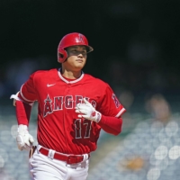 The Angels' Shohei Ohtani rounds the bases after hitting his 29th home run of the season during a loss against the White Sox in Anaheim, California, on Thursday. | KYODO