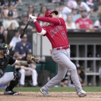 Shohei Ohtani hits his second home run of the game during the Angels' win over the White Sox in Chicago on Wednesday. | KYODO