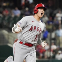Angels designated hitter Shohei Ohtani celebrates after hitting his second home run of the night against the Rangers in Arlington, Texas, on Monday. | USA TODAY / VIA REUTERS