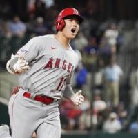 Angels designated hitter Shohei Ohtani celebrates after hitting his second home run of the night against the Rangers in Arlington, Texas, on Monday. | USA TODAY / VIA REUTERS