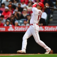 Los Angeles Angels starting pitcher Shohei Ohtani hits a two-run home run against the Seattle Mariners on Friday. | USA TODAY / VIA REUTERS
