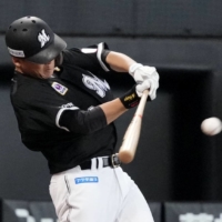 Lotte's Shingo Ishikawa drives in the game-winning run with his seventh-inning single against the Fighters at Es Con Field Hokkaido on Saturday. | KYODO